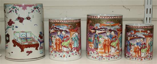 A graduated set of three Chinese export famille rose mugs and another larger, Qianlong period, 10cm-13cm and 16.5cm (4)